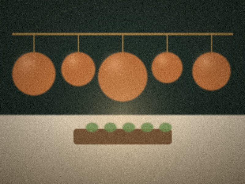 Batterie de casseroles en cuivre suspendue dans une cuisine de maison